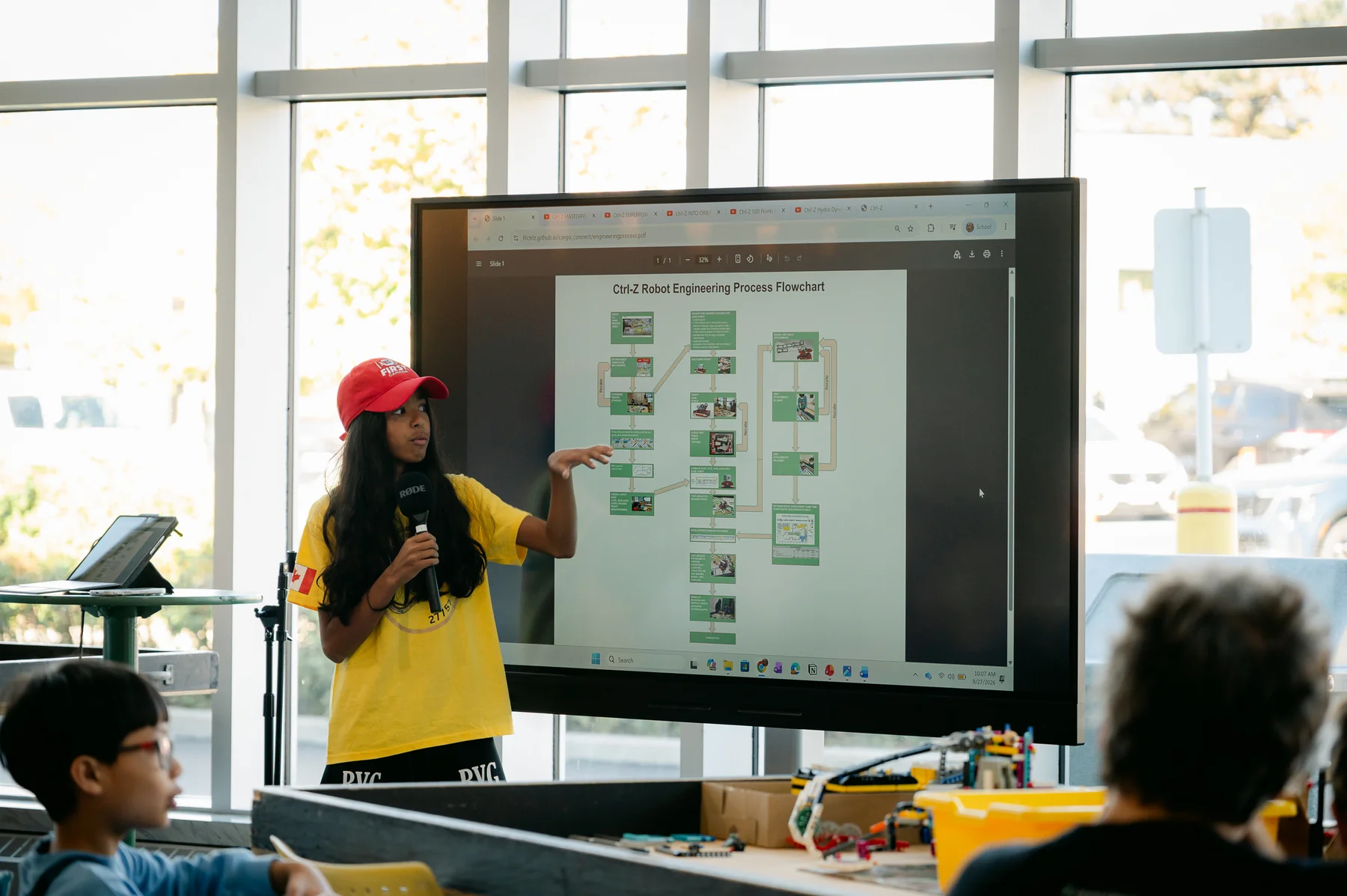 A team member presenting the robot engineering process